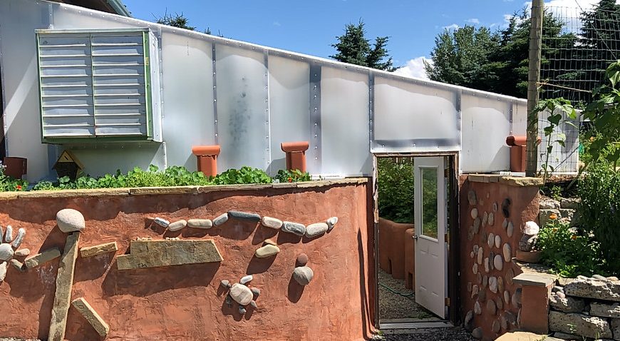 Walipini Sunken greenhouse wraps home & feeds suburban antifragile co-op