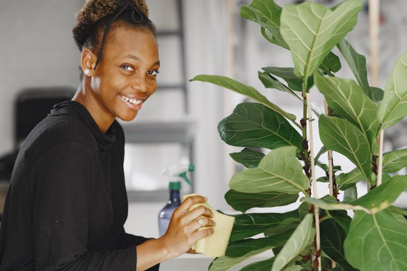 Smiling Woman with Plant